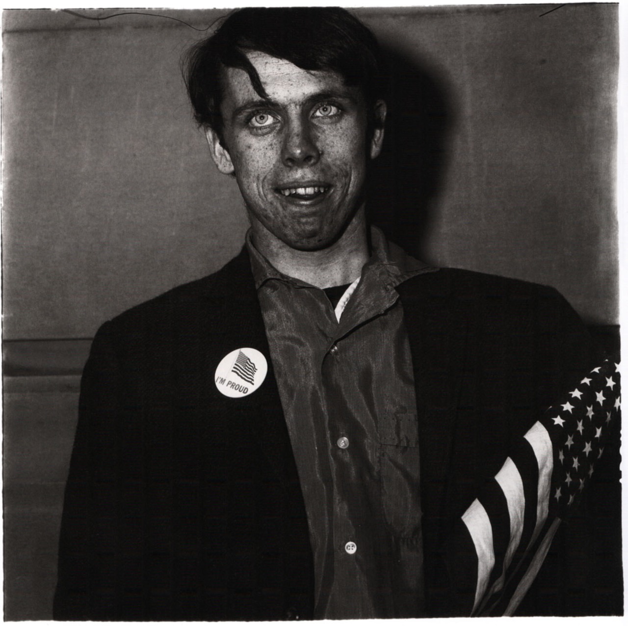 Patriotic young man with a flag, N.Y.C. (1967) - Photo by Diane Arbus